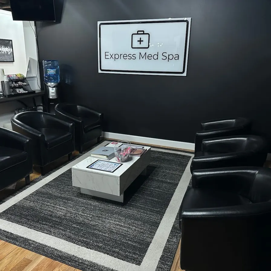 Modern waiting area at Express Med Spas in Frankfort, IL featuring leather chairs and spa amenities.