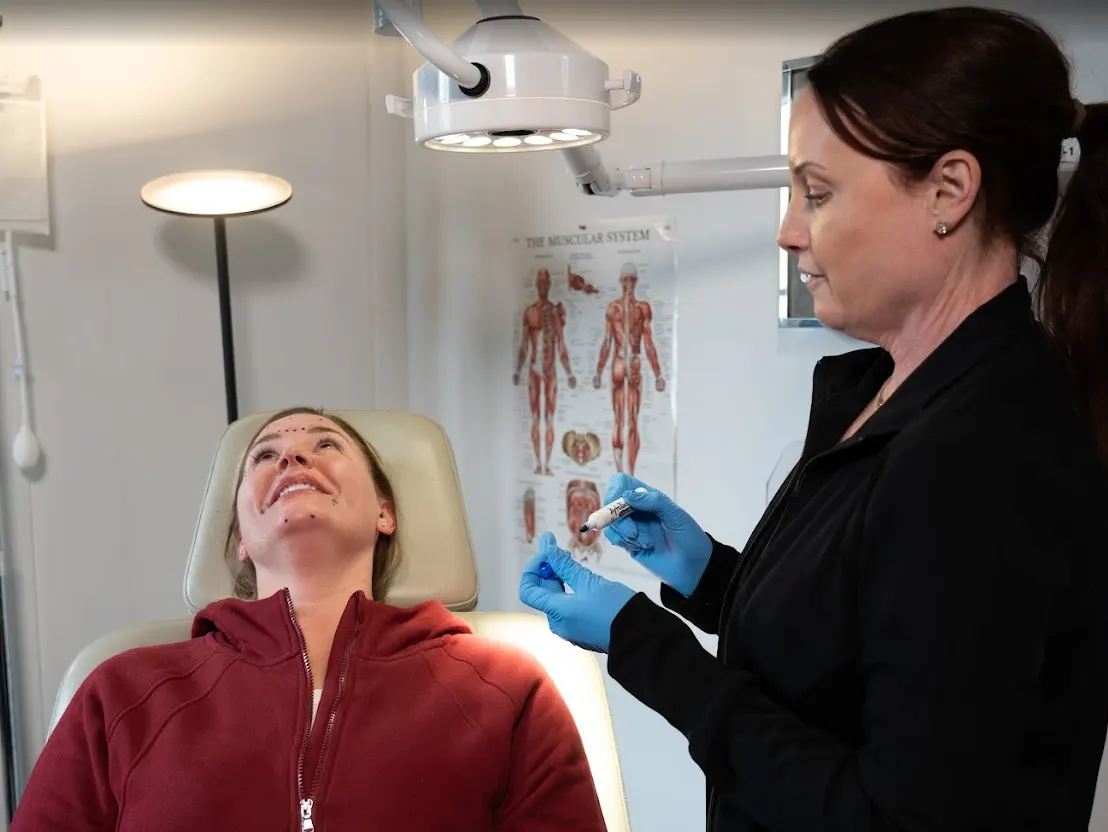 Patient receiving Letybo treatment consultation with facial mapping at Express Med Spa Mount Greenwood, Chicago