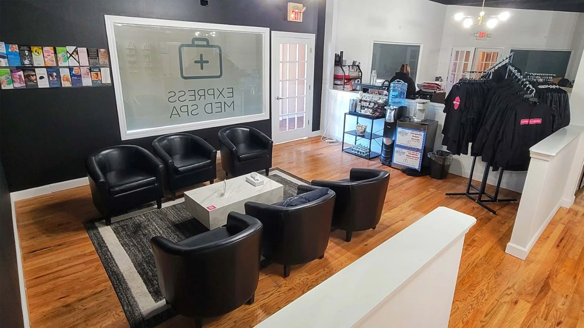 Modern waiting area at Med Spa Frankfort with branded lounge setup
