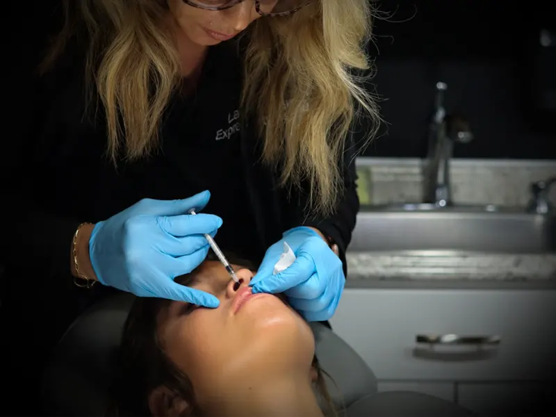 Nurse injector performing Versa Lip Filler treatment at Express Med Spa La Grange IL with focus and precision