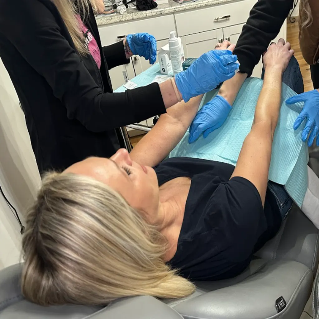 Woman receiving a VI Peel arm treatment at Express Med Spa, relaxed and supported by expert hands